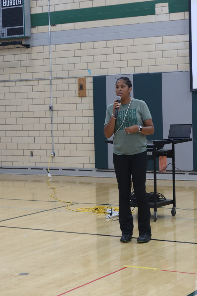 adult speaking on microphone