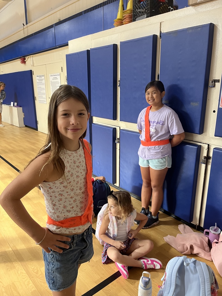 Safety patrol students are proudly wearing their orange belts.