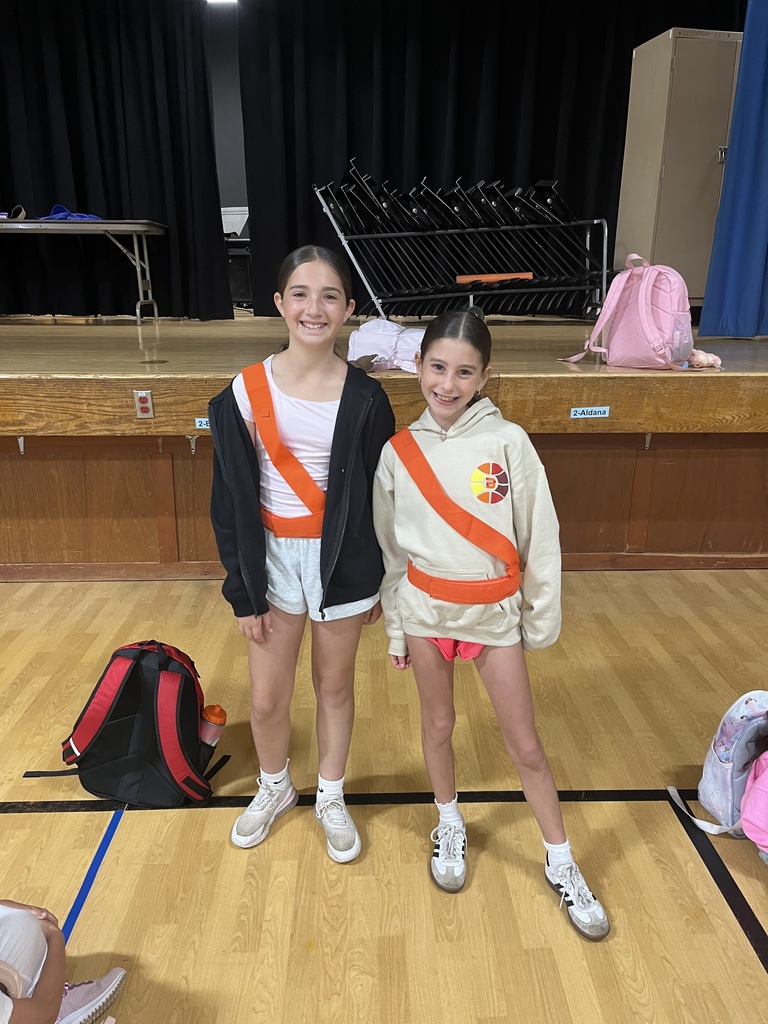 Safety patrol students are proudly wearing their orange belts.