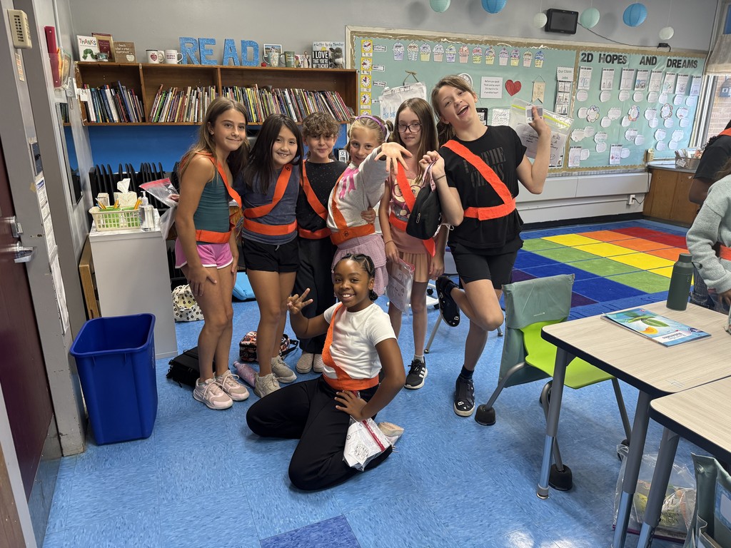 Safety patrol students are proudly wearing their orange belts.
