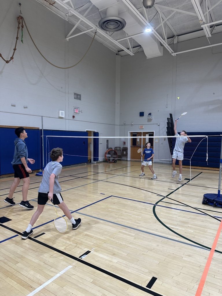 Look at the birdie fly! 8th graders are thoroughly enjoying the badminton unit in PE class.