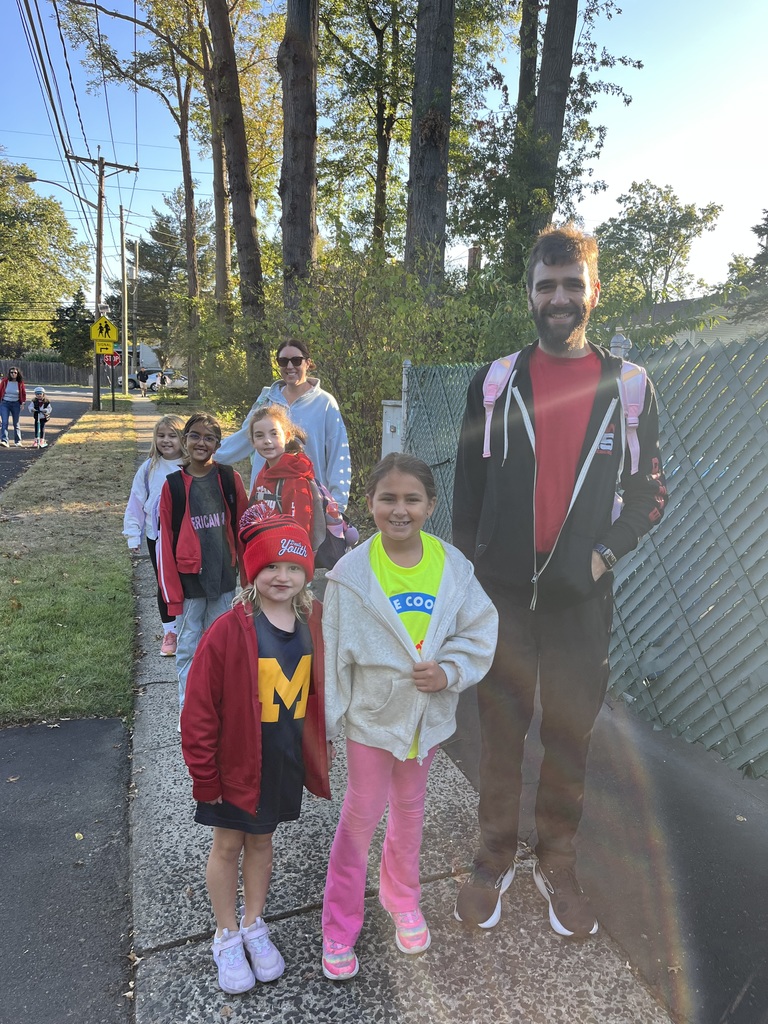 Students and families walk to school.