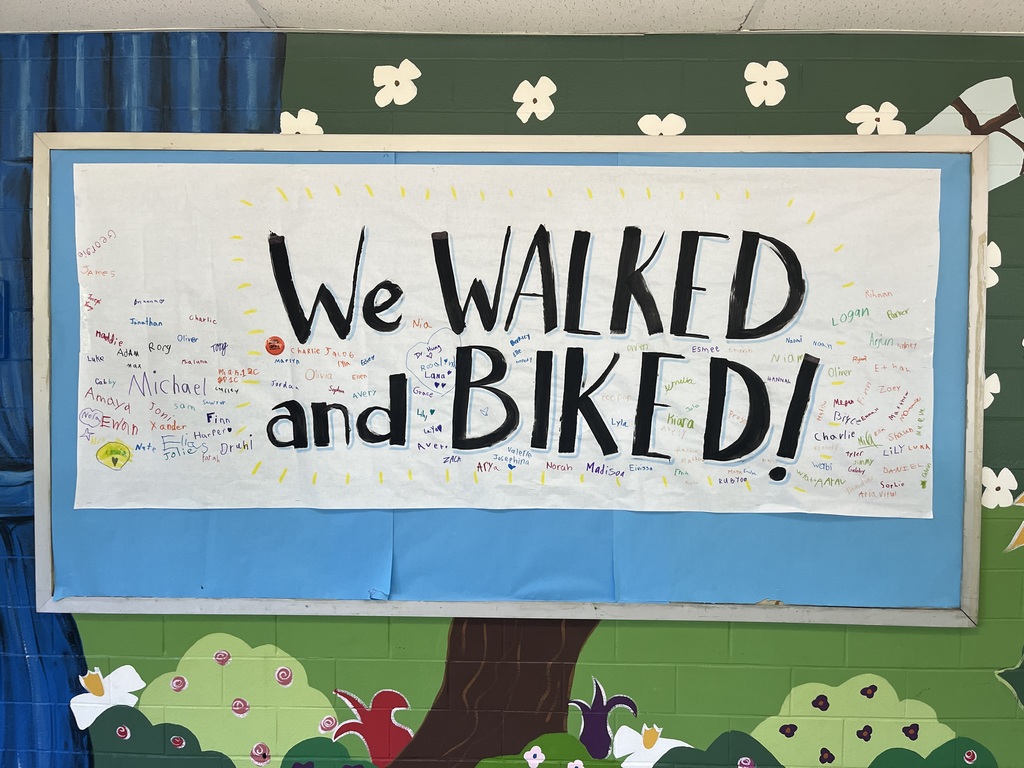 Students signed a banner to show they walked to school today.