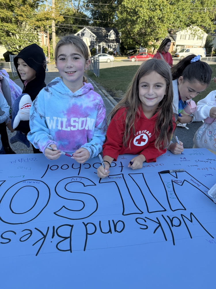 students signing school banner