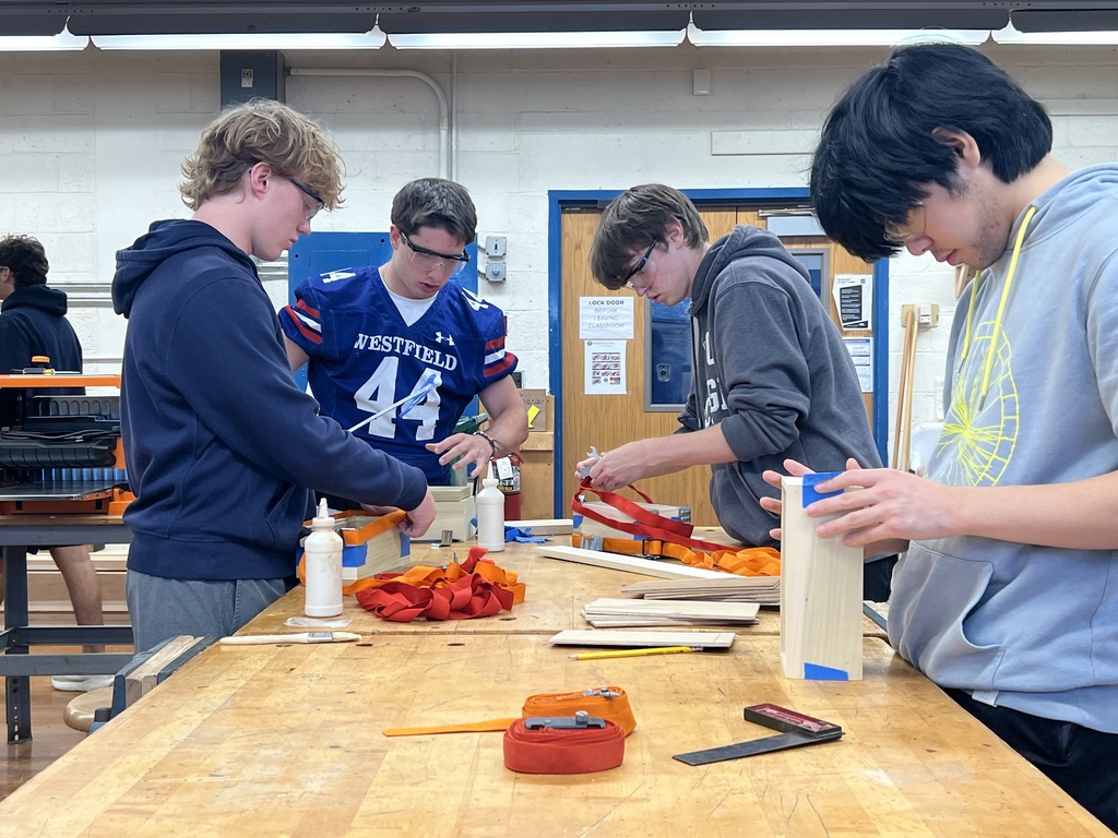 Students glueing boxes