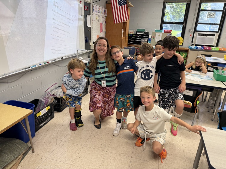 teacher and students wearing mismatched clothes