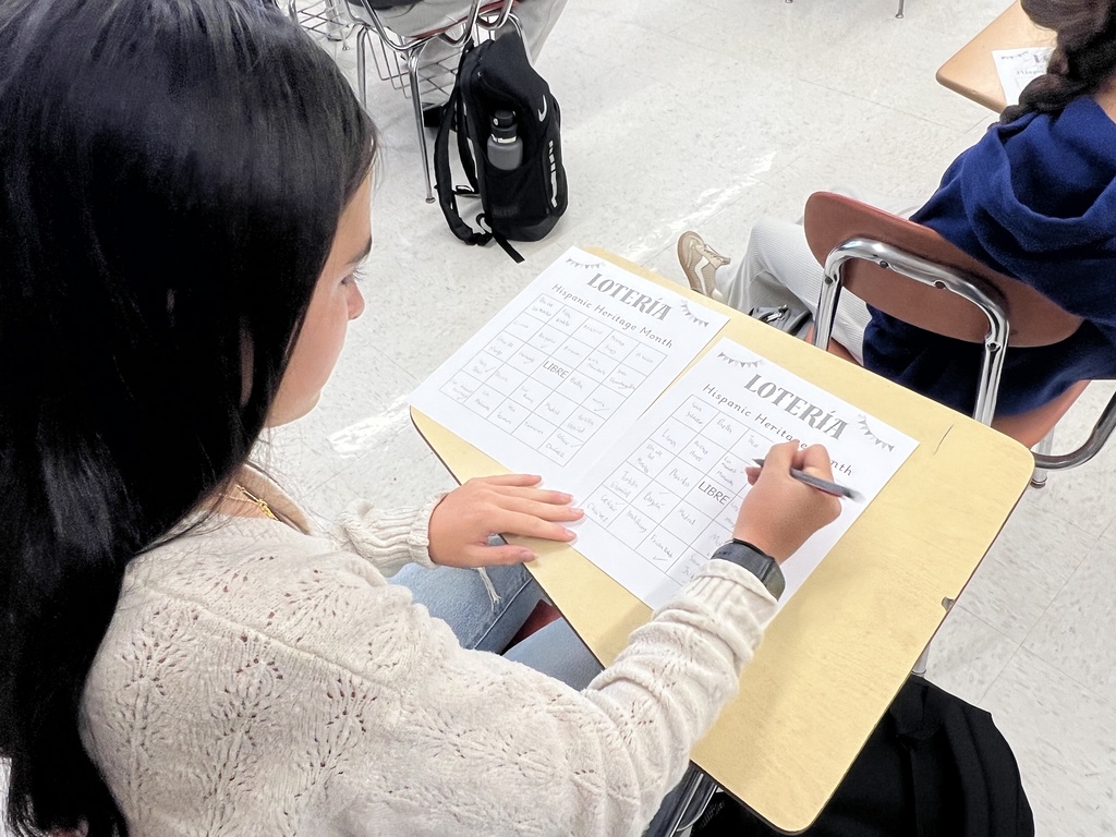 Student checking off boxes 