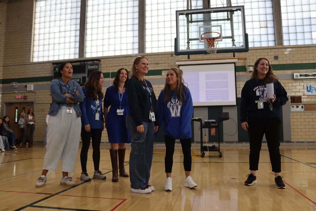 women standing and smiling