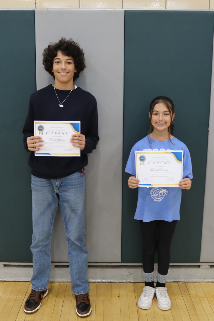 7th grade students holding certificates