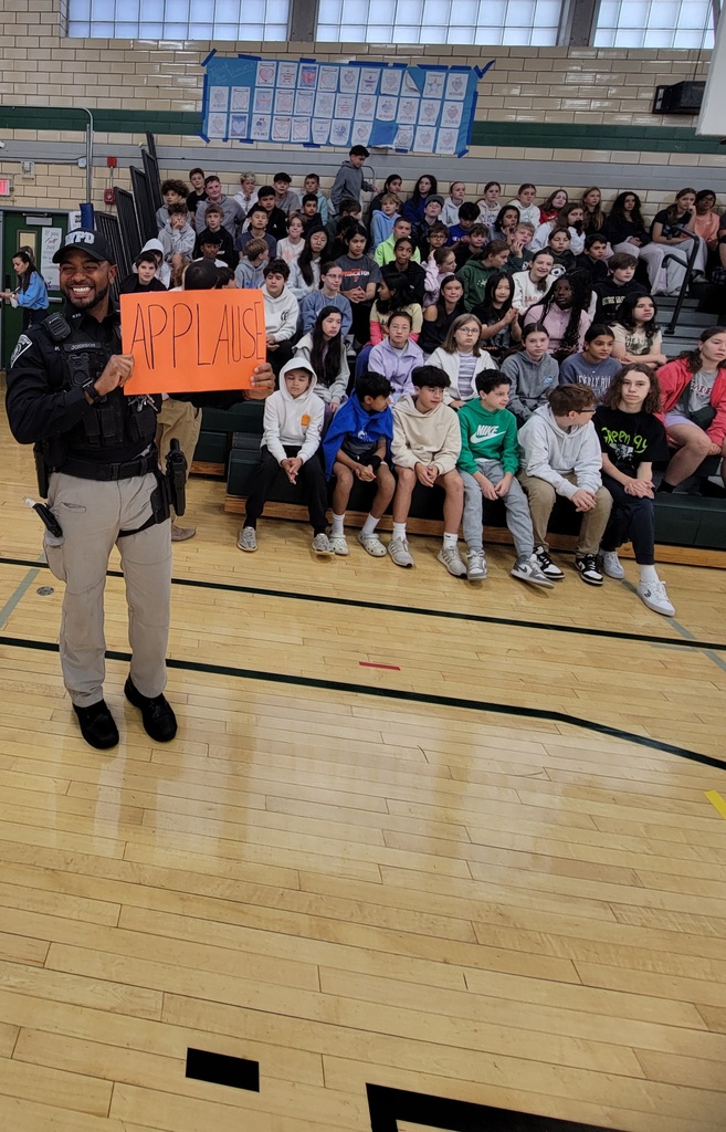 Officer holding sign