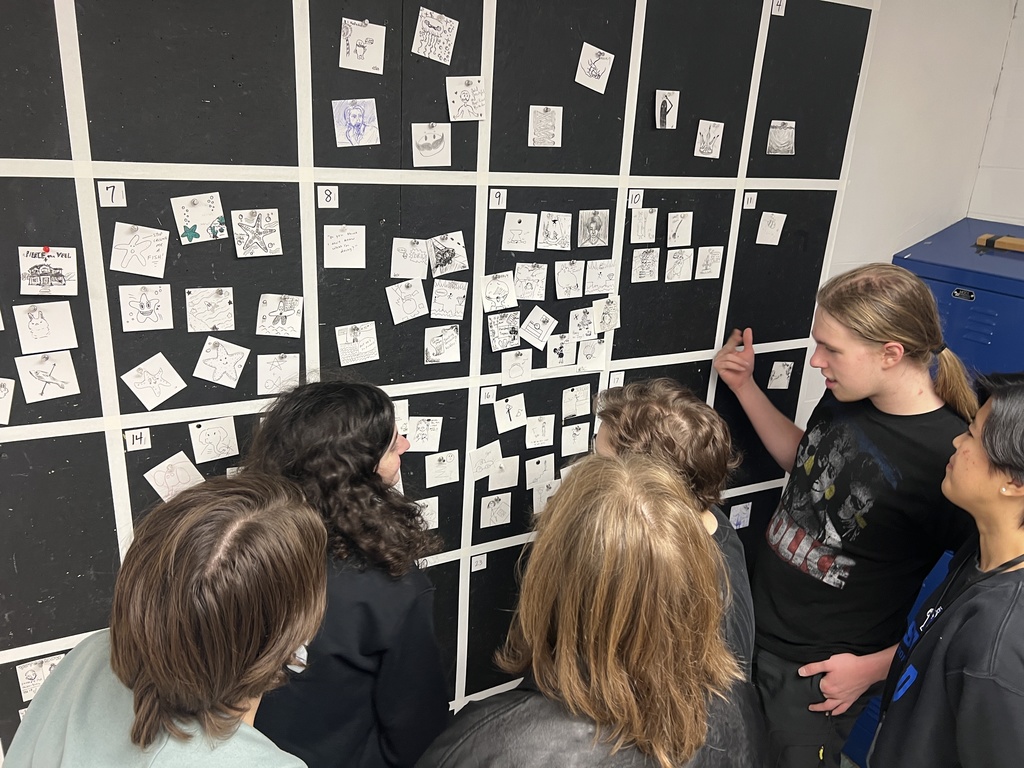 Students looking at pictures