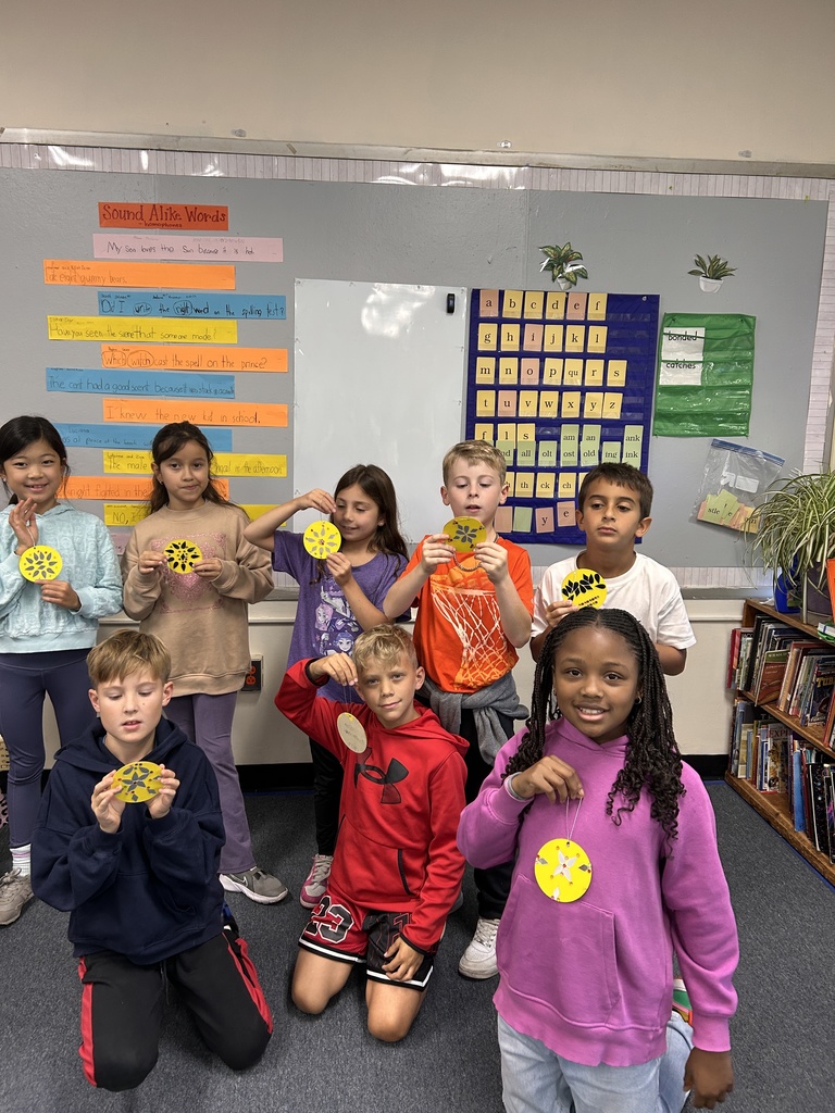 Students showing their finished light.