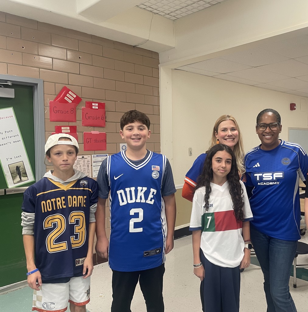 students and adults smiling