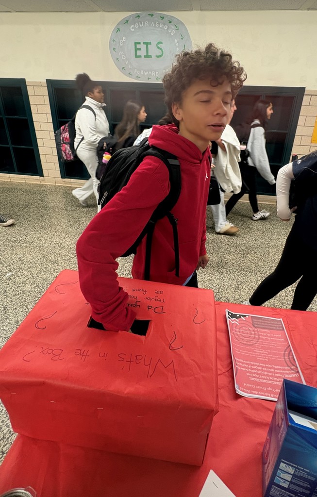 Student guessing what's in the box 