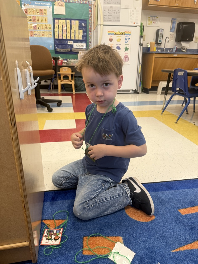 student engages in the dramatic play center during choice time