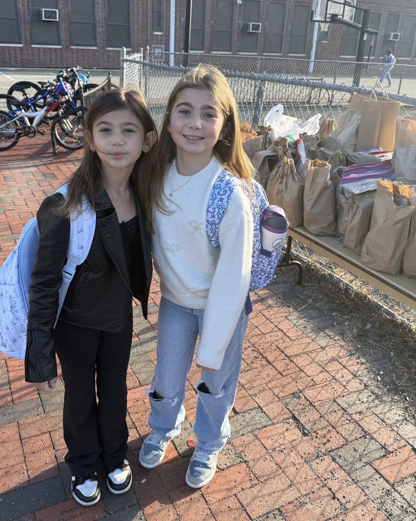 student standing by donation  table