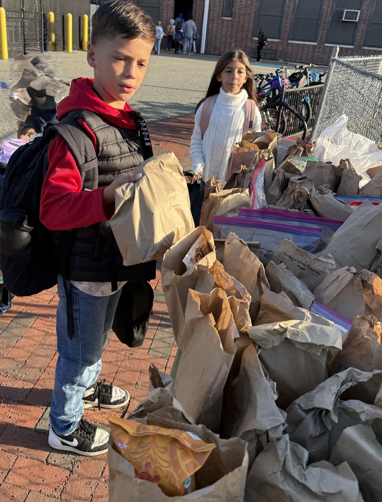 students placing donation on table