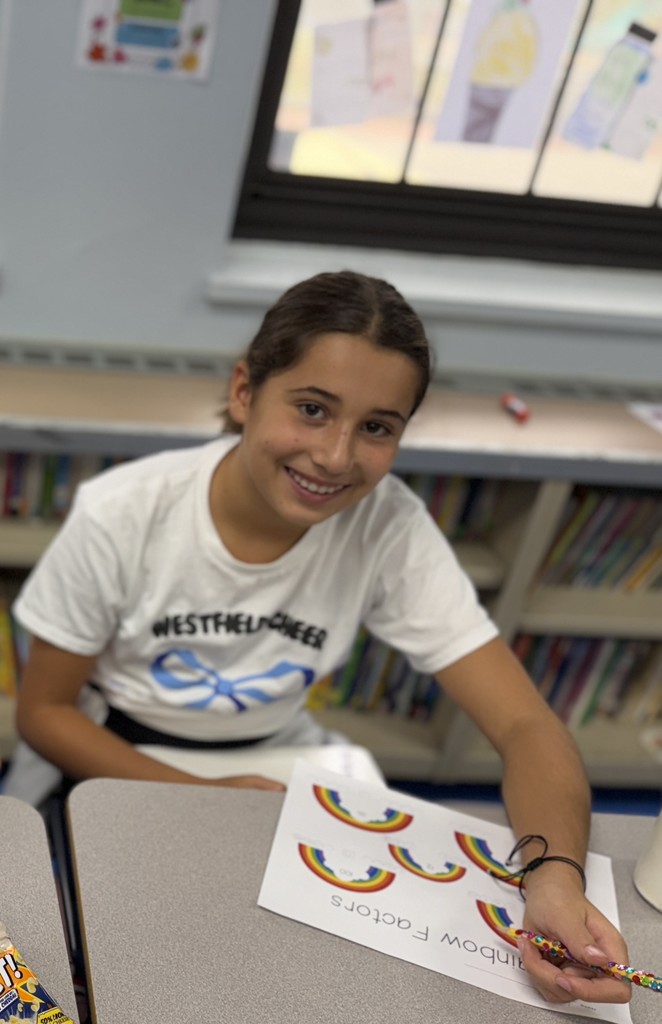 student working on factor rainbows