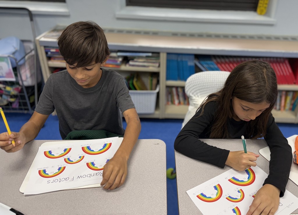 students working on factor rainbows