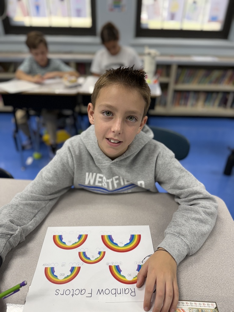 student working on factor rainbows