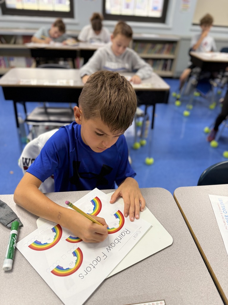 student working on factor rainbows