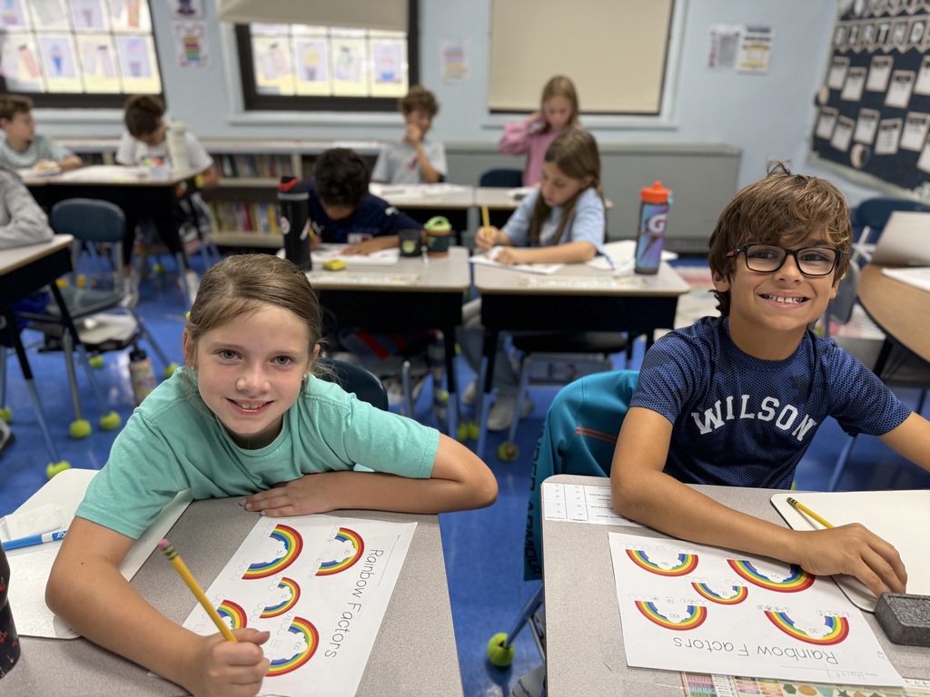 students working on factor rainbows