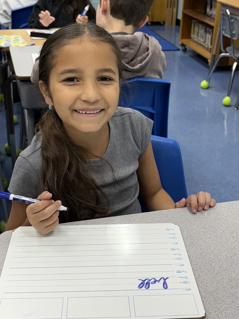 student practicing cursive writing