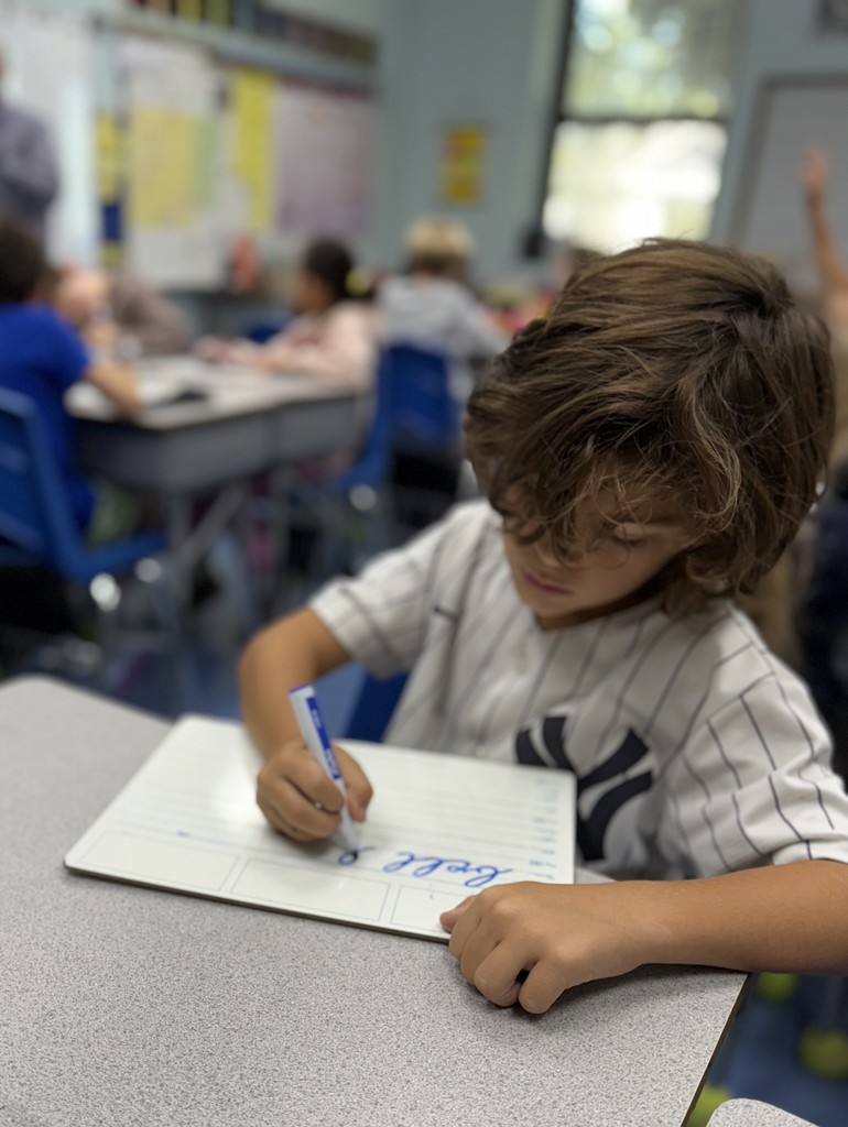 student practicing cursive writing