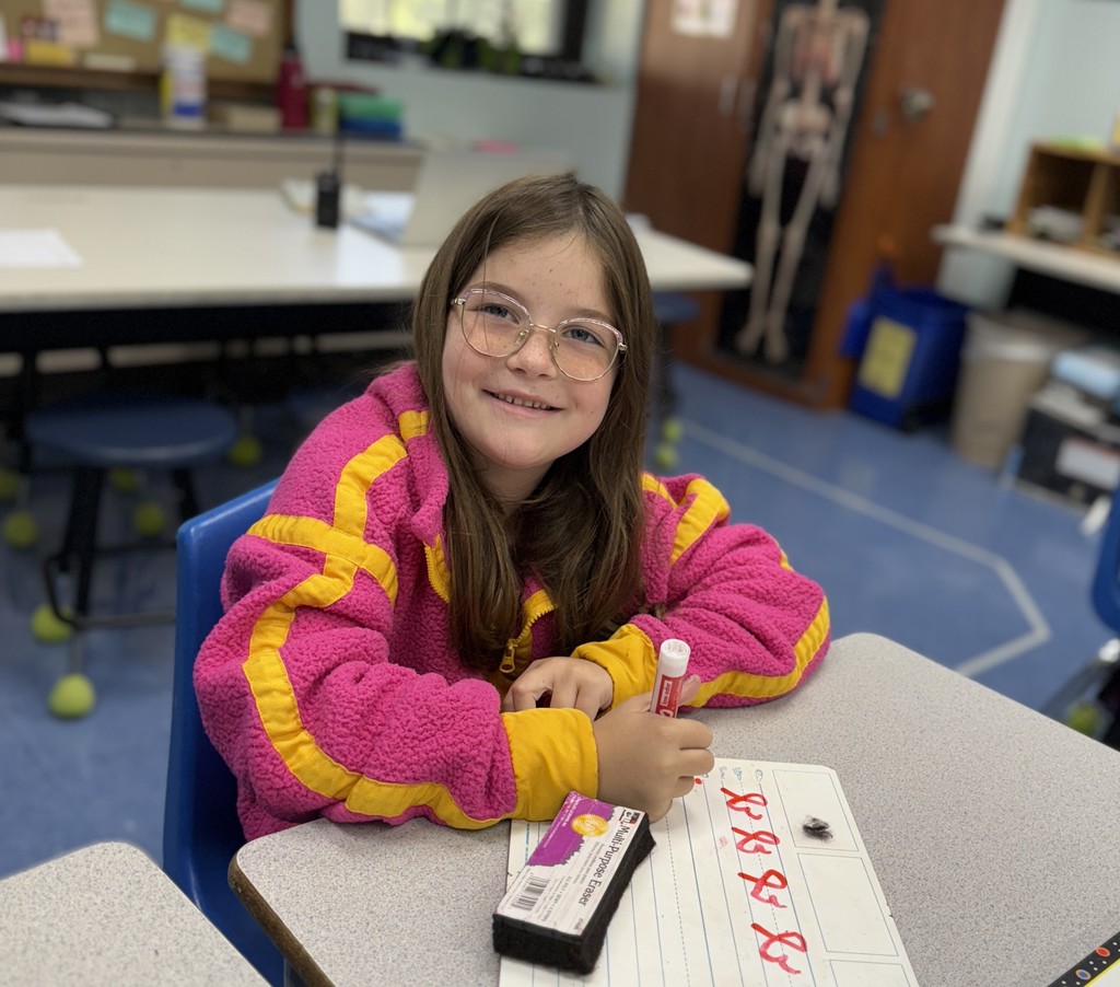 student practicing cursive writing