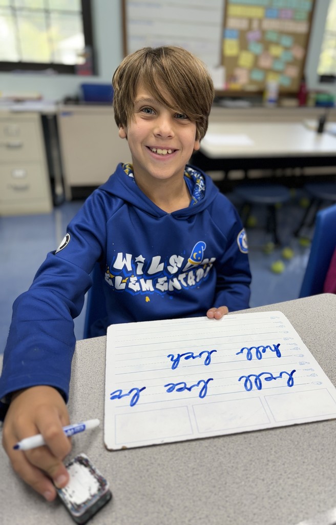 student practicing cursive writing