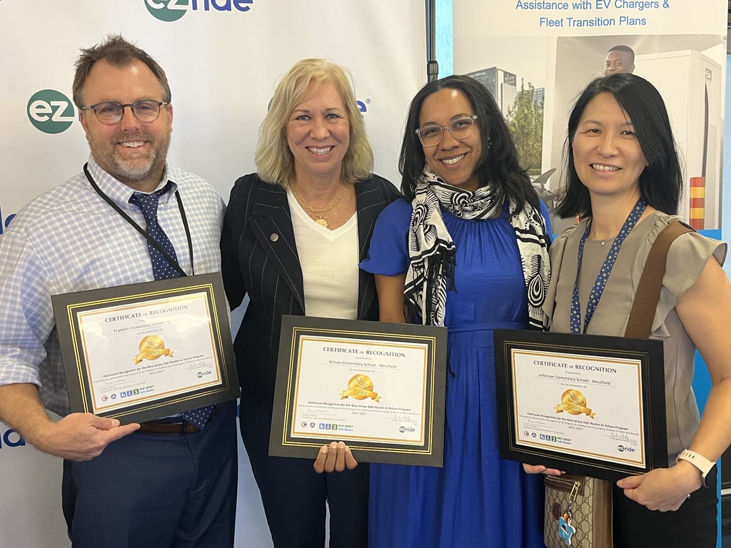 3 of westfield elementary principals, standing with the mayor of Westfield, holding their awards