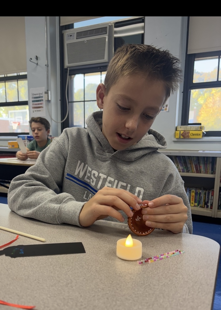 student working on diya