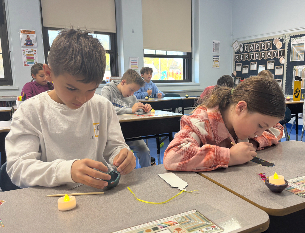 students working on diyas
