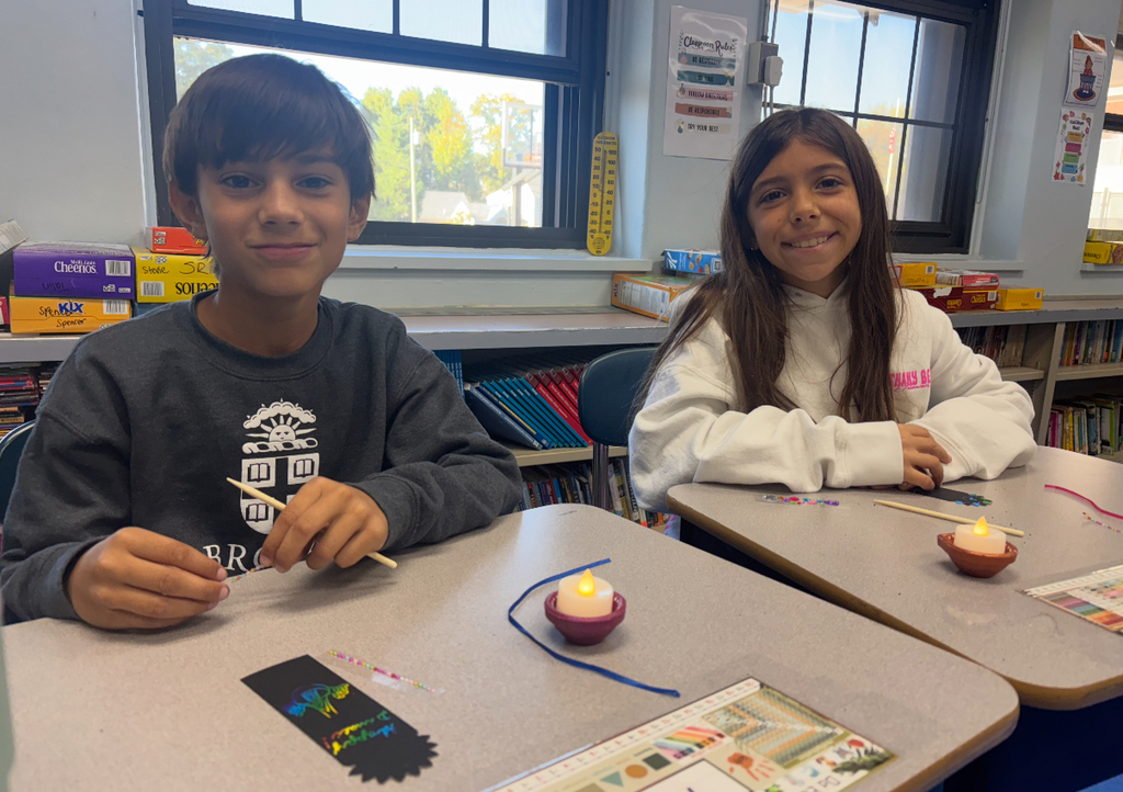 students working on diyas