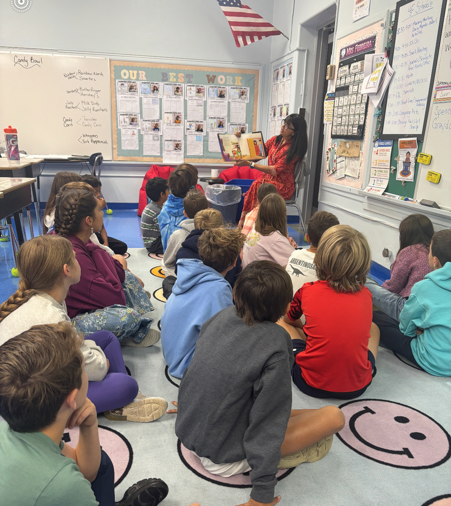 students listening to book about Diwali