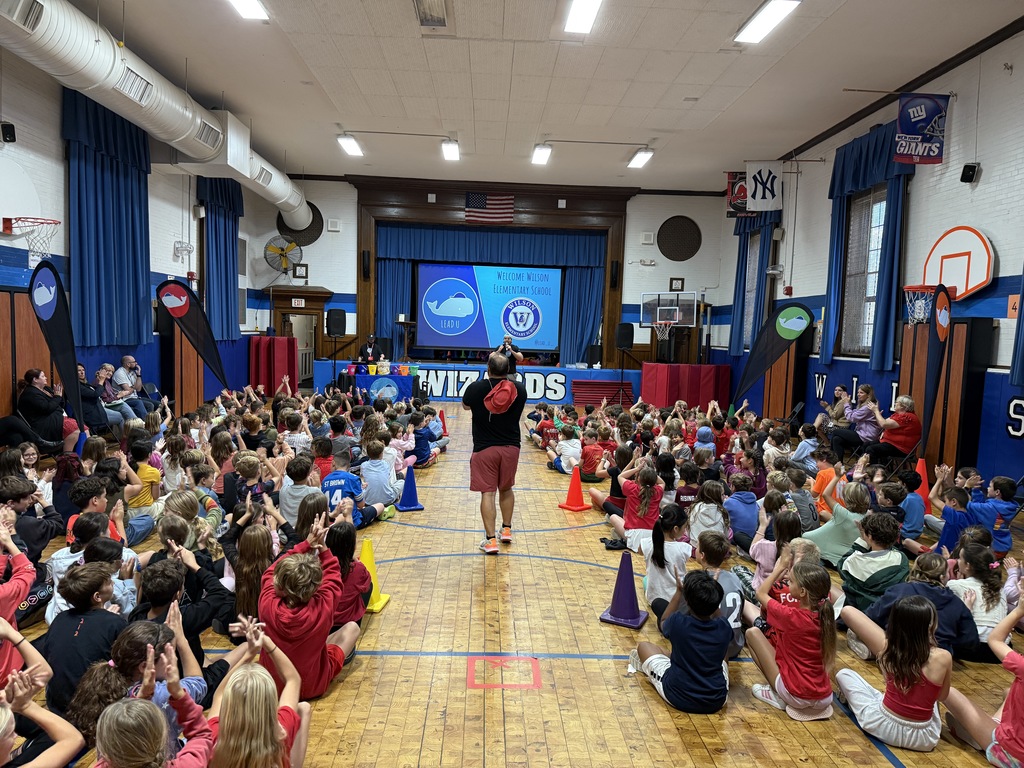 students sitting in the gym during LeadU assembly