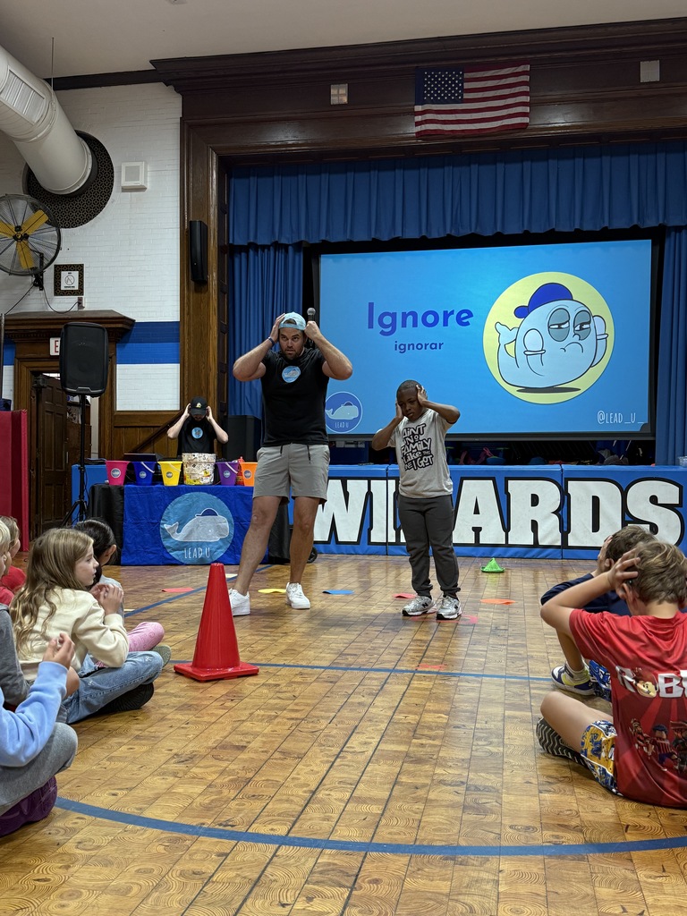 student participating in LeadU assembly with presenter