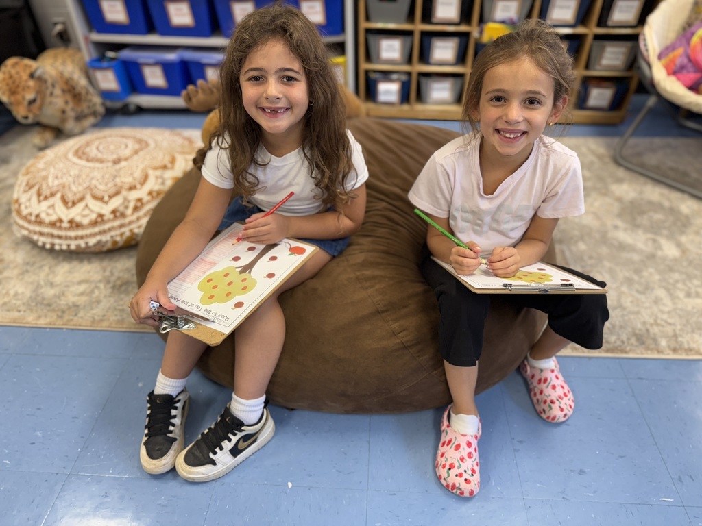 first graders working with a partner in math centers