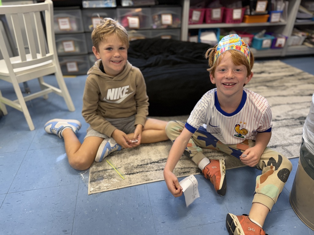 first graders working with a partner in math centers