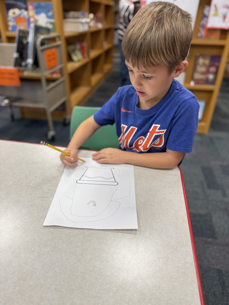 student working on their "wonderfully weird" plant