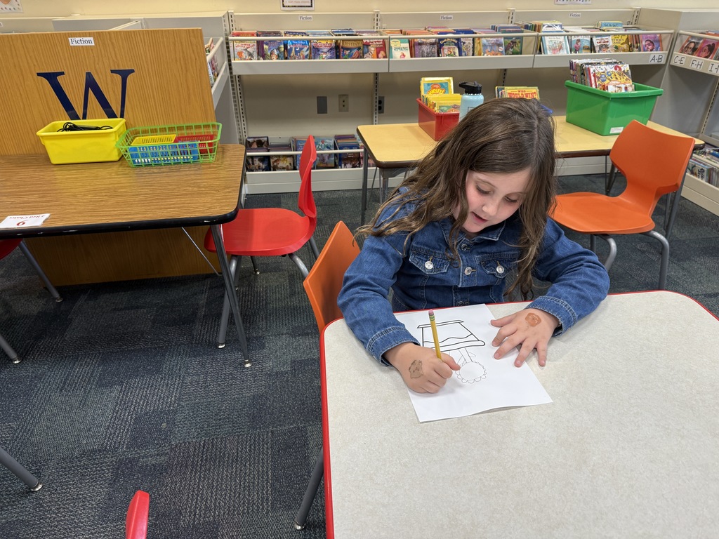 student working on their "wonderfully weird" plant