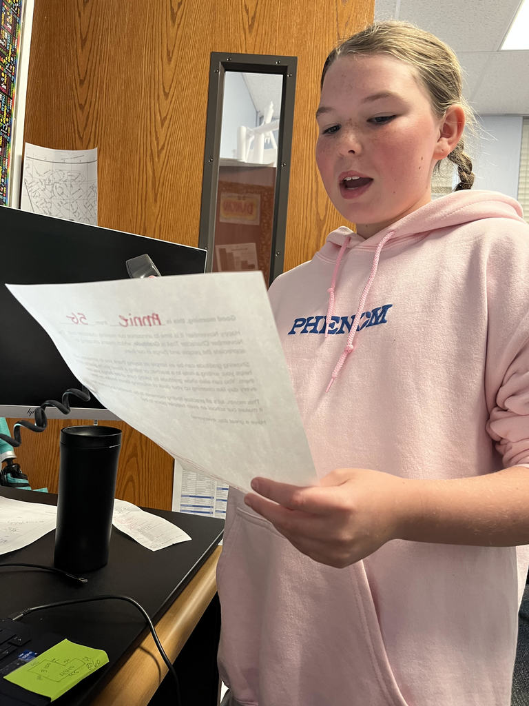 Student reading announcement 