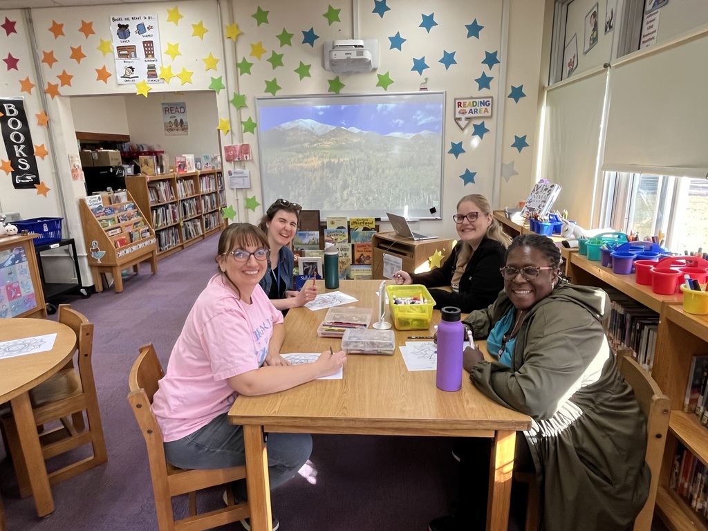 Teachers engaged in mindful coloring.