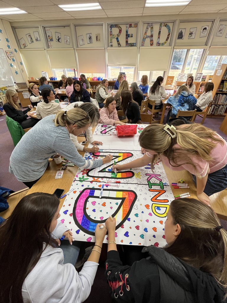 Teachers engaged in mindful coloring.