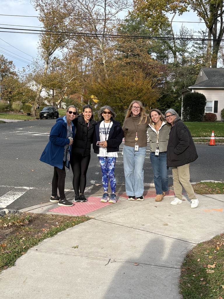 Teachers enjoy a walk around the neighborhood on this beautiful fall day.