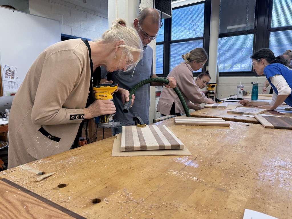 Teachers making cutting boards