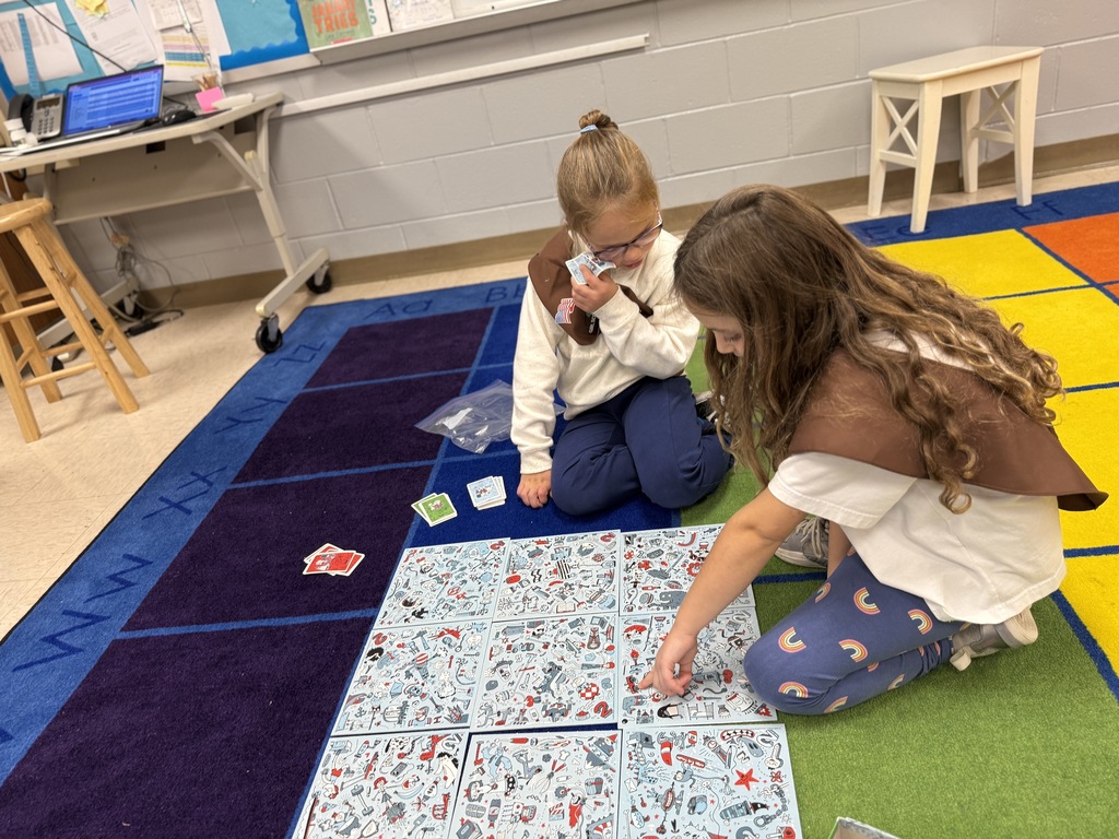 students playing games on the rug at recess