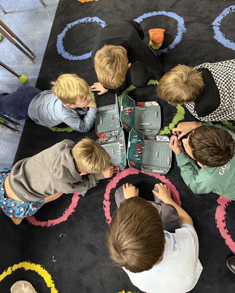 students playing games on the rug at recess