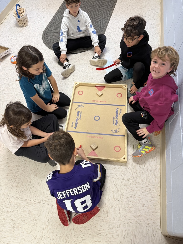 students playing games on the floor at recess