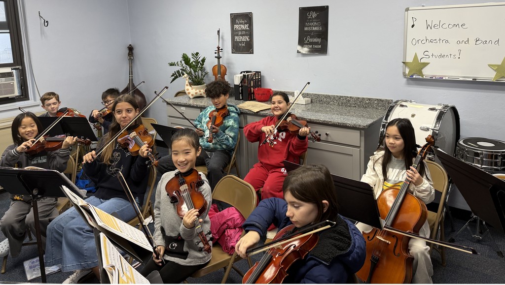 orchestra students playing instruments